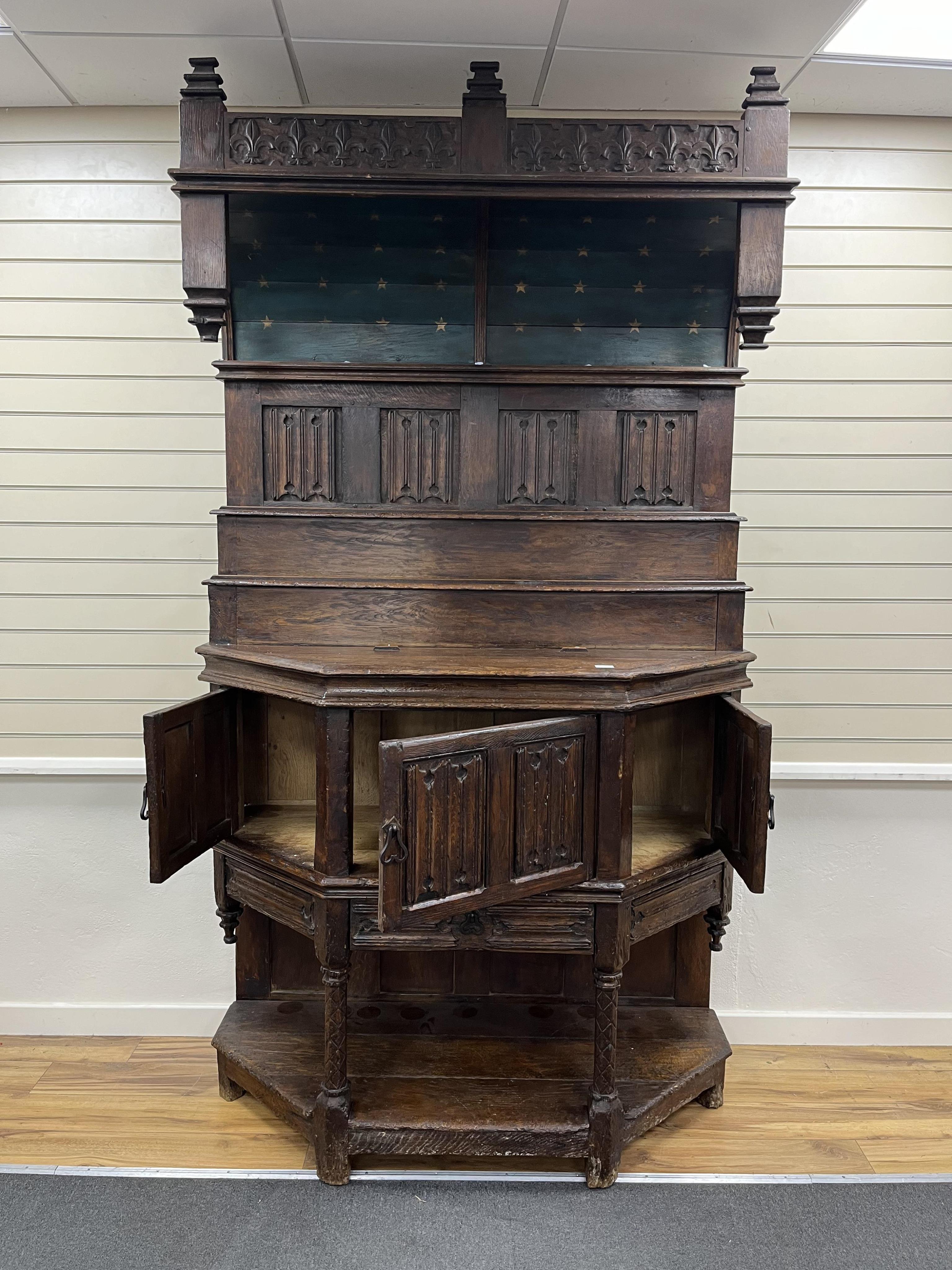 A tall Gothic linenfold panelled oak dresser (dressoir), in 15th century French style, width 143cm, depth 62cm, height 252cm. Condition - fair to good, Provenance - made for Brede Place, Brede, Rye, East Sussex. Commissi